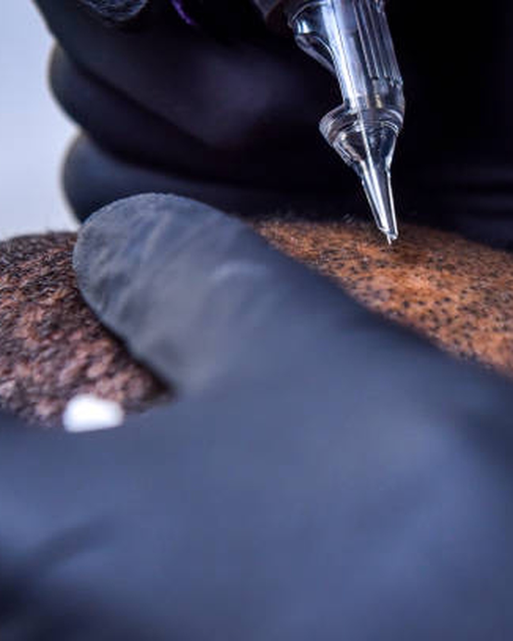 AHNEWME technician performing an in-home scalp micropigmentation appointment